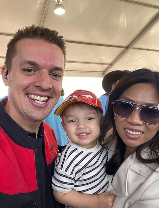 Image of Tyler Hoover with his wife, Quynh Anh Hoover, and their son